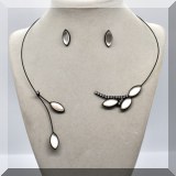 J085. Black bypass choker necklace with white stones and moonstones and matching stud earrings. - $45 